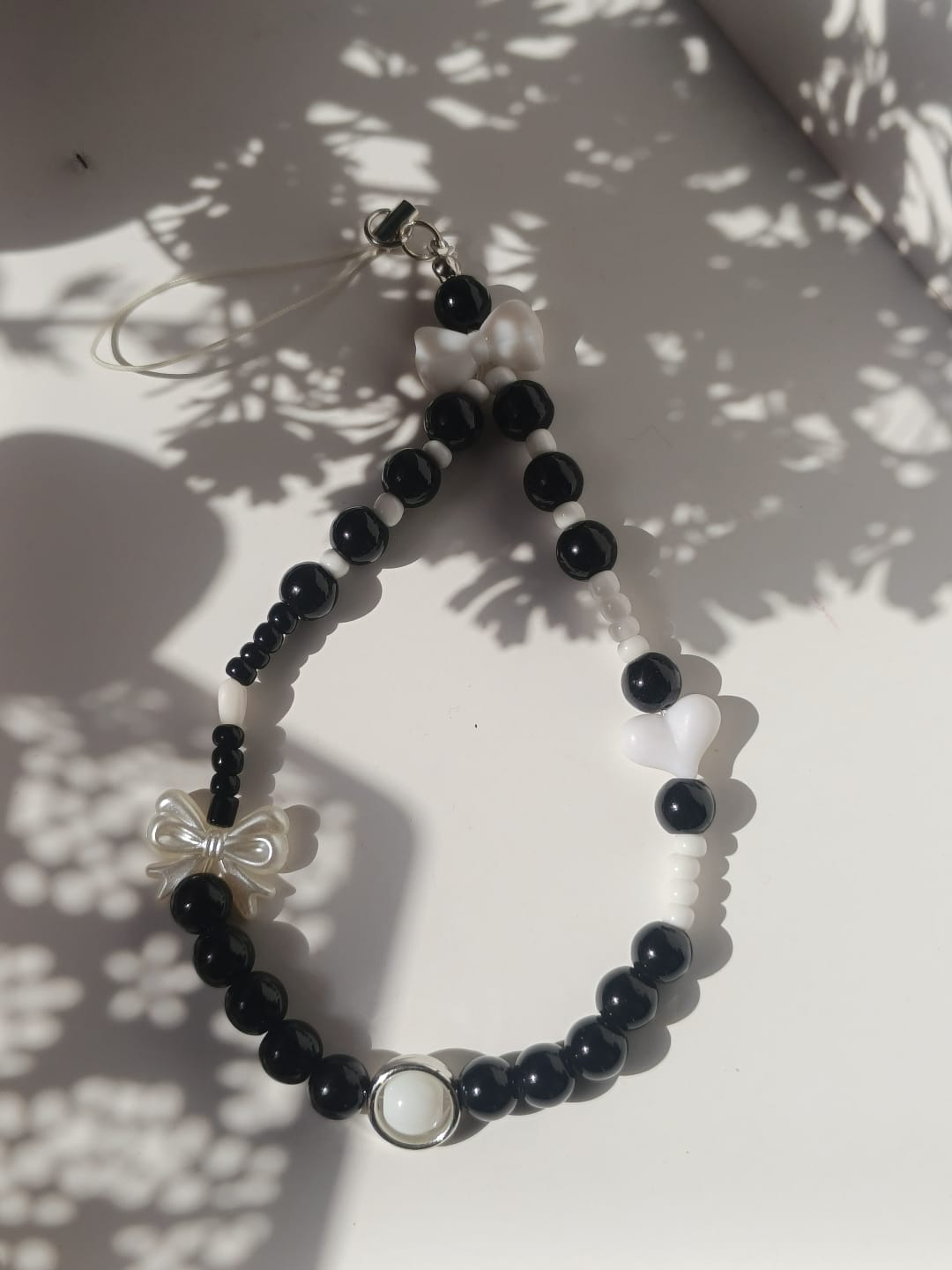 Balck beauty bow charm phone lanyard